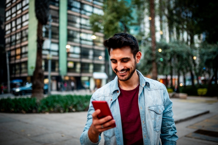 Man using iPhone in public